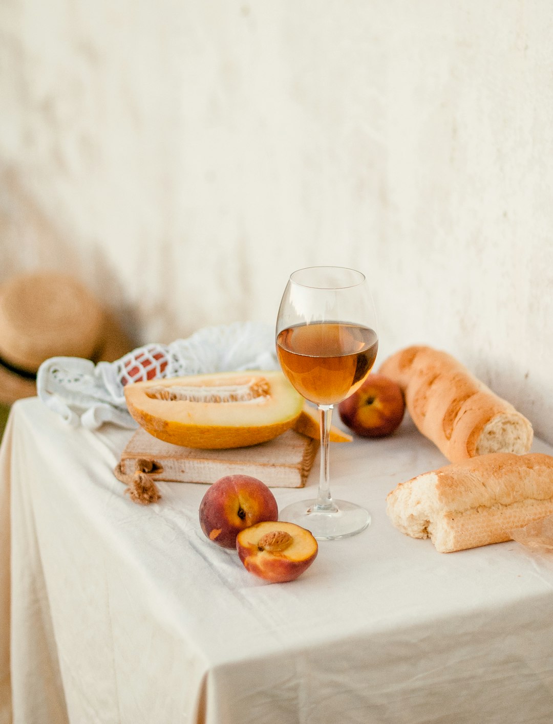 bread and wine glass on table