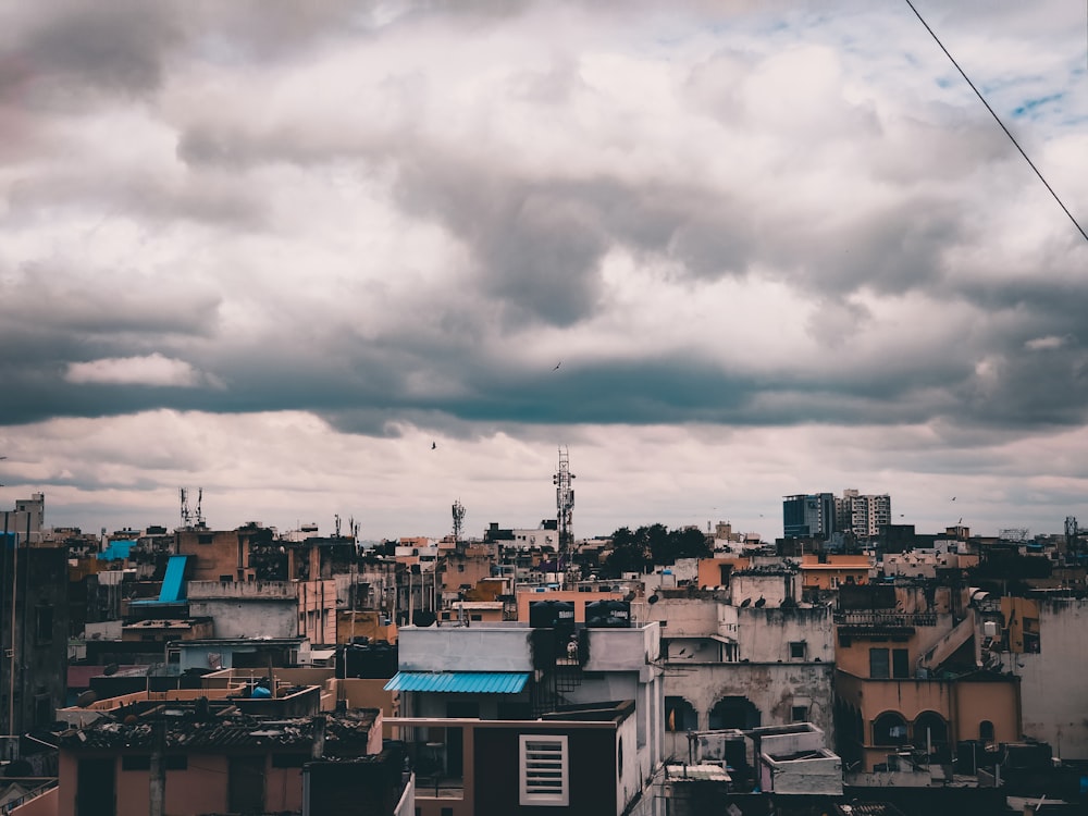 white and blue concrete building under white clouds during daytime