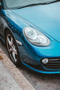 blue car with white and black car wheel