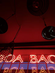 A sleek industrial facility with deep red and charcoal tones reflecting bromine-inspired branding.