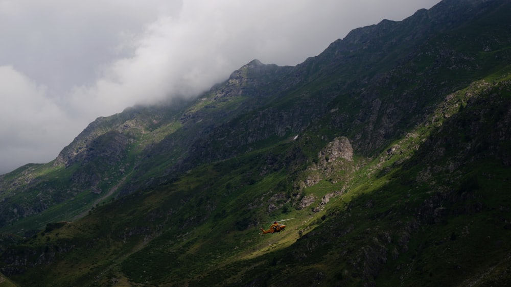 green and brown mountain under white clouds during daytime