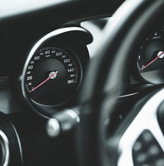 black and silver car speedometer