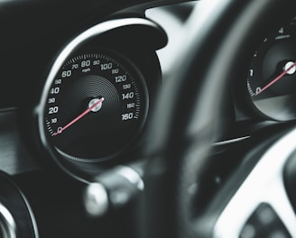 black and silver car speedometer