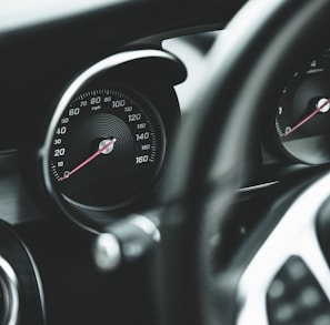 black and silver car speedometer