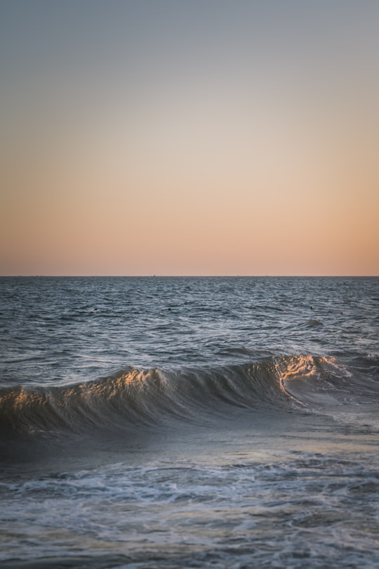 ocean waves crashing on shore during sunset in Mui Ne Vietnam