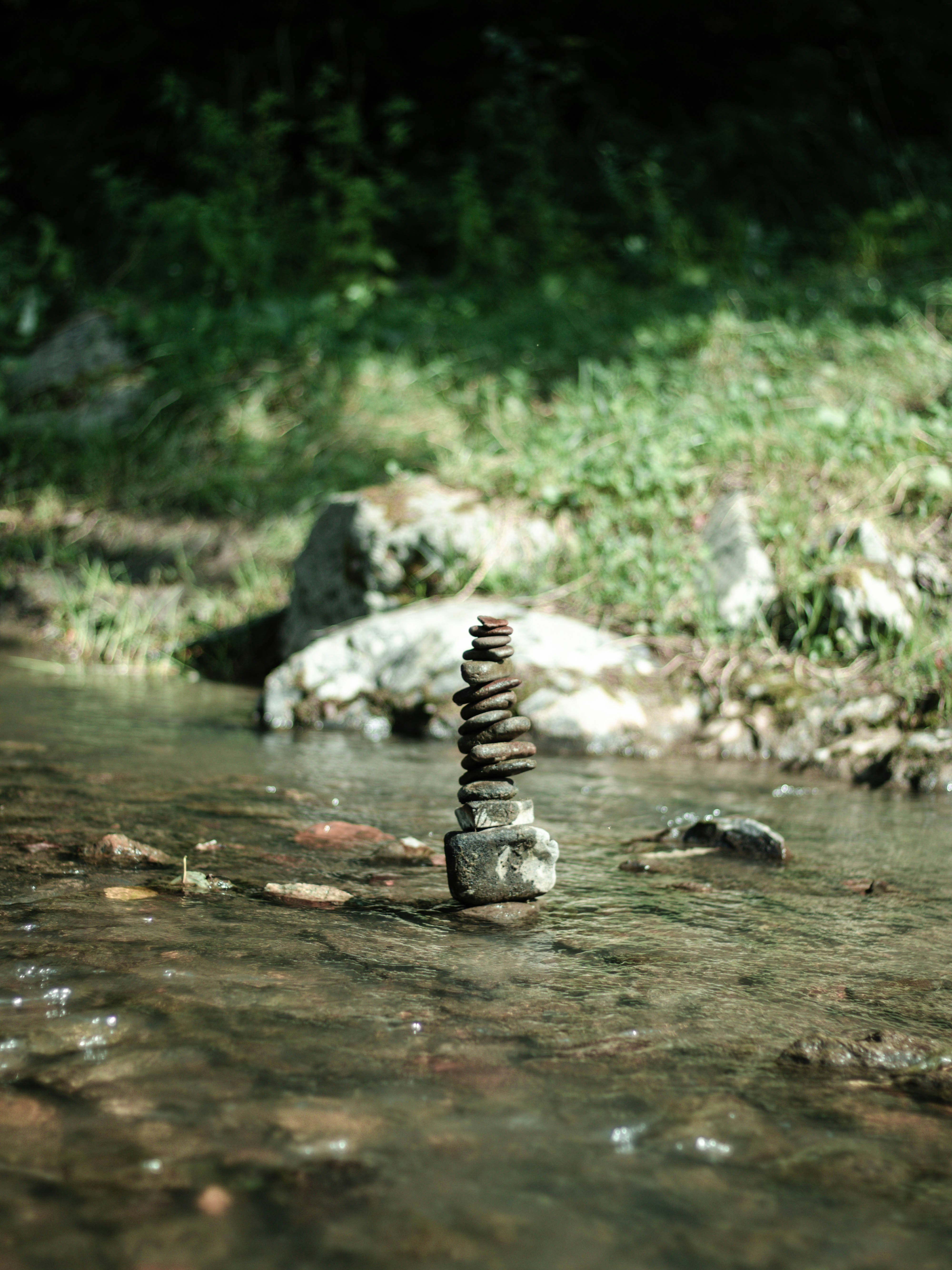 black and gray stones on water