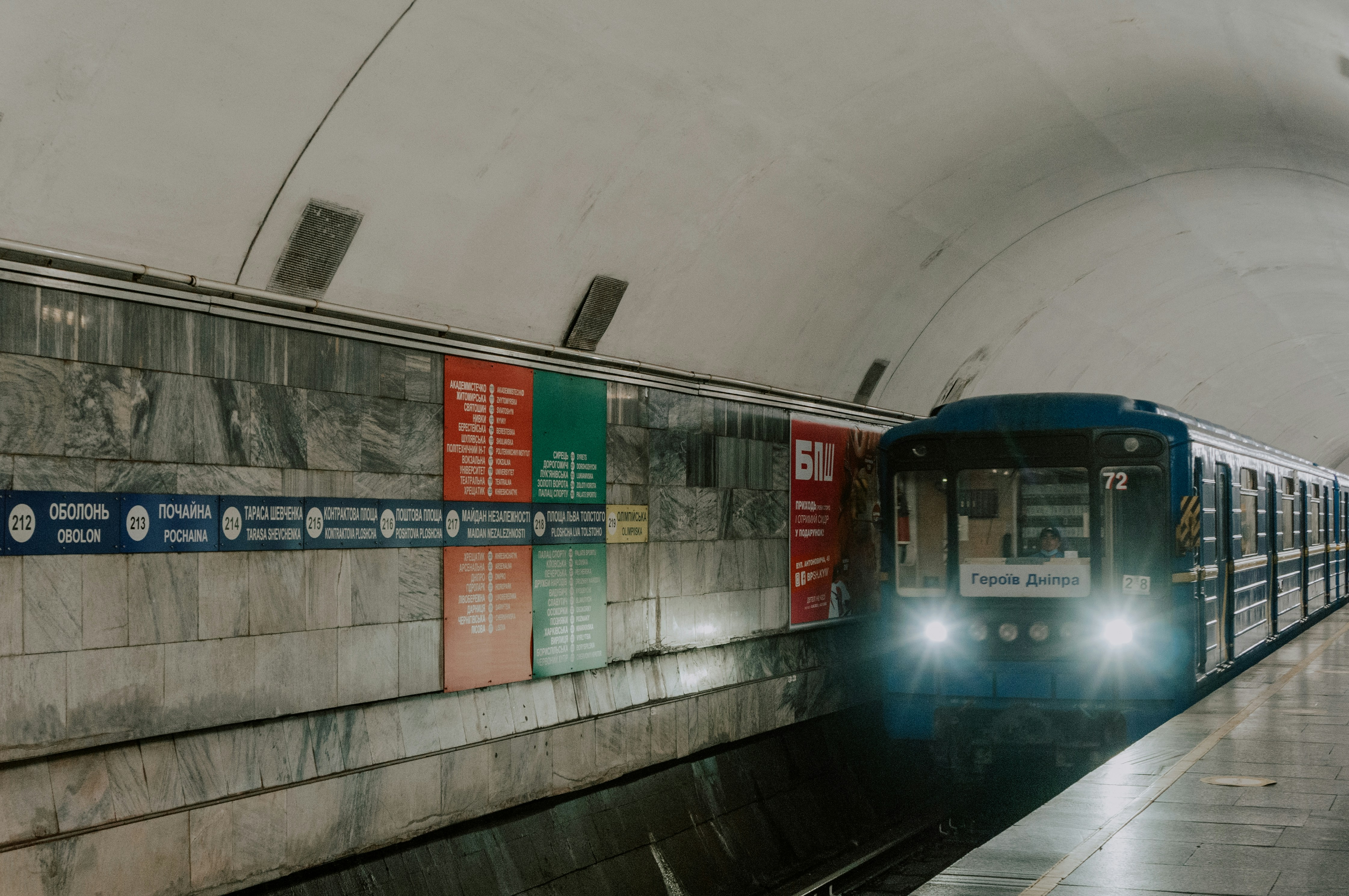 a subway train pulling into a subway station