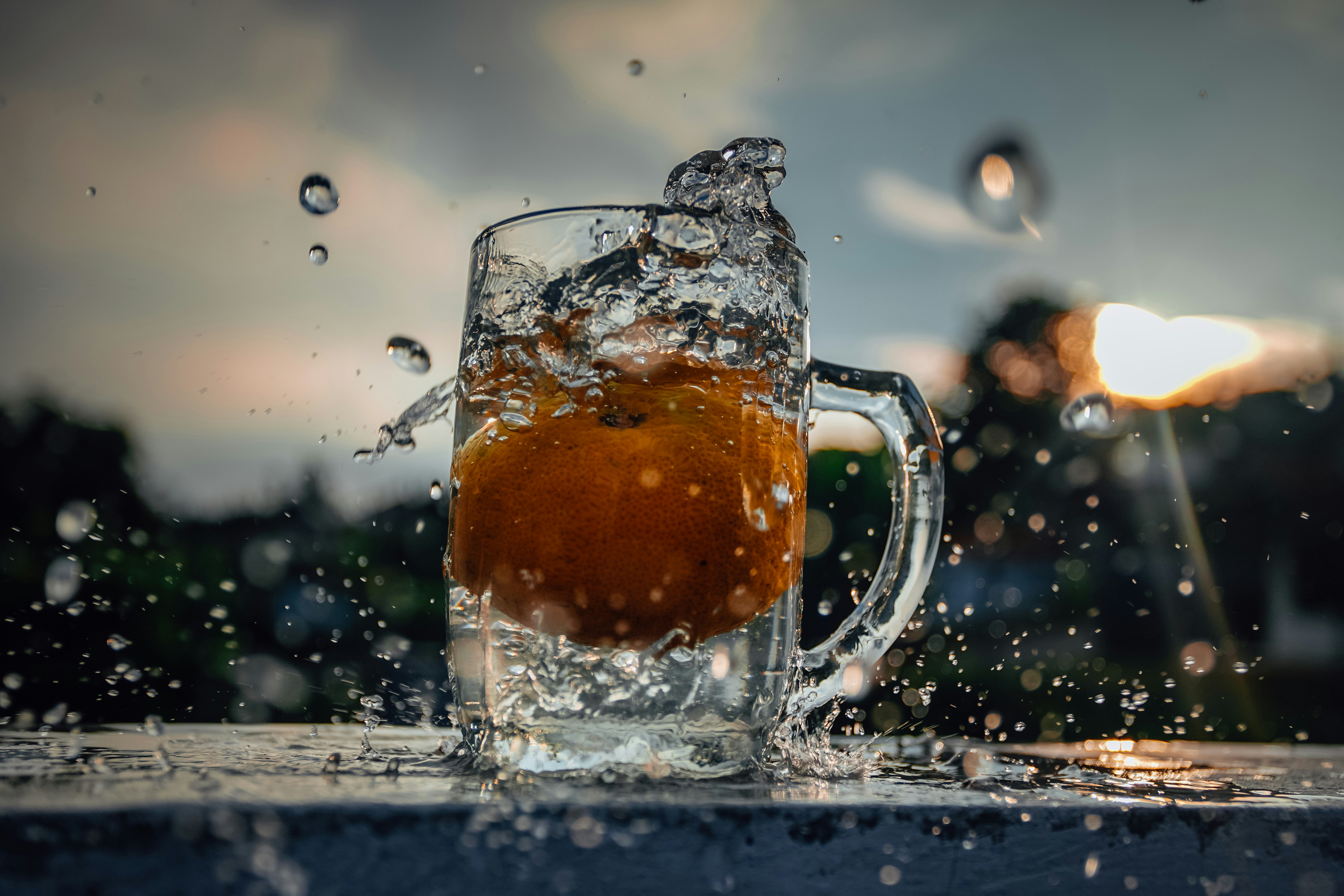 clear glass mug with brown liquid