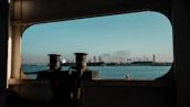 Panoramic view of Klaipeda port with multiple vessels and bustling activity.