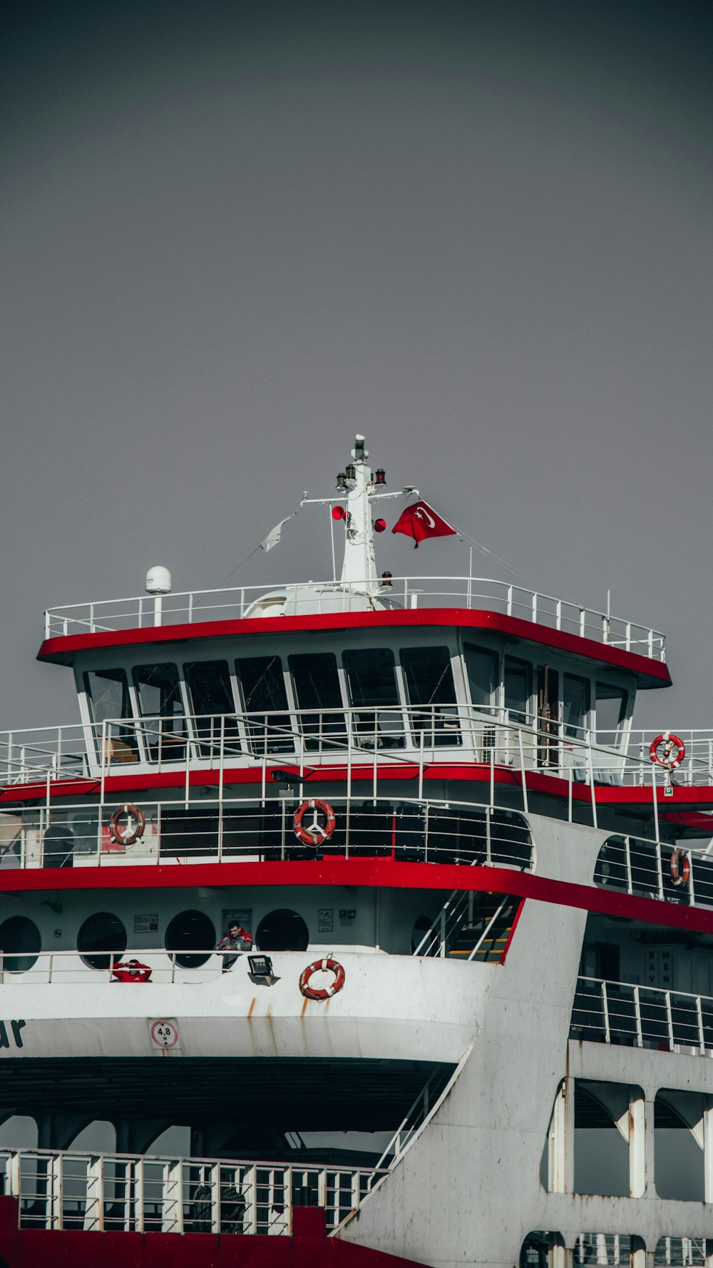 white and red ship on sea