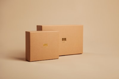 brown cardboard box on white table package teams background