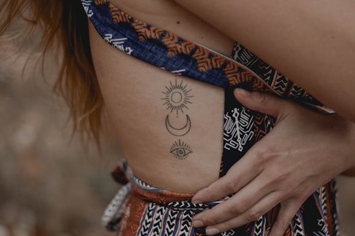 woman with floral tattoo on her right side
