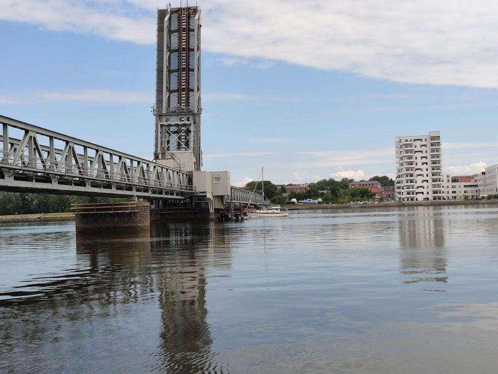 white bridge over river during daytime