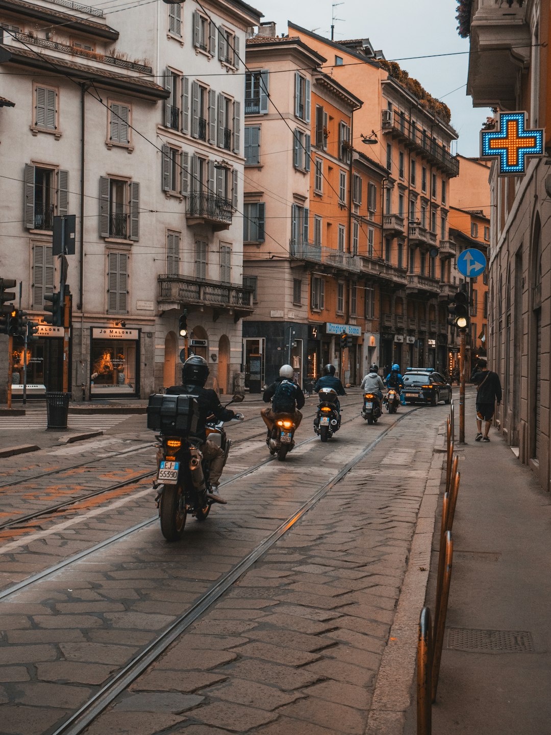 people riding motorcycle on road during daytime