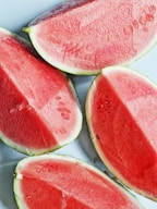 sliced watermelon on white ceramic plate