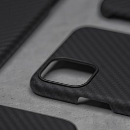 A close-up of a minimalist phone case in soft matte finish on a marble surface.