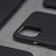 Close-up of a sleek black iPhone case with a minimalist design on a white background.