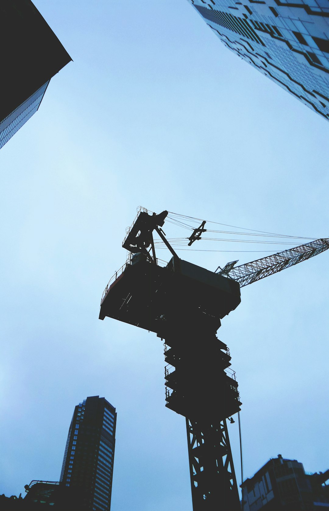 black and gray metal crane under blue sky during daytime