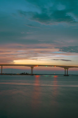 A serene bridge glowing softly at twilight, symbolizing connection and inner journey.