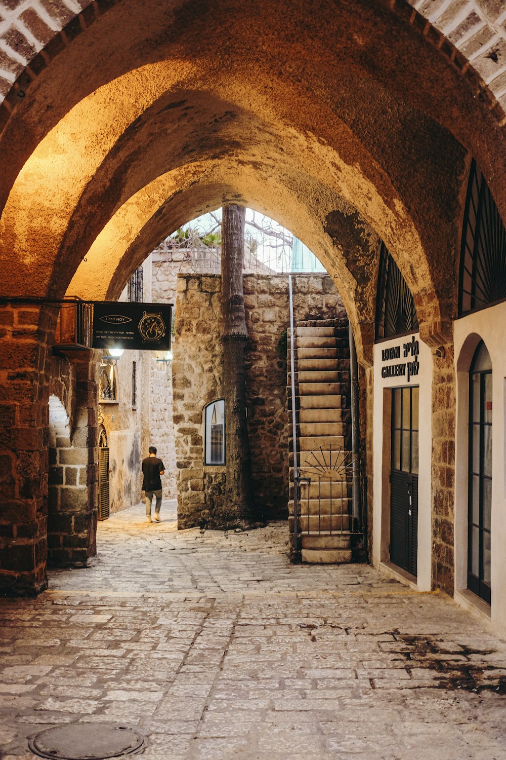 brown brick building with brown wooden door