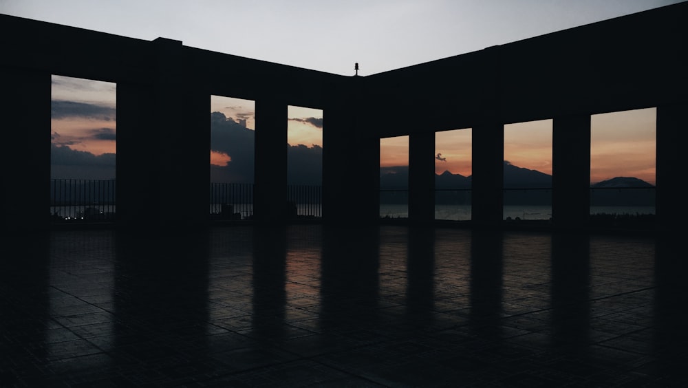 silhouette of bridge over water