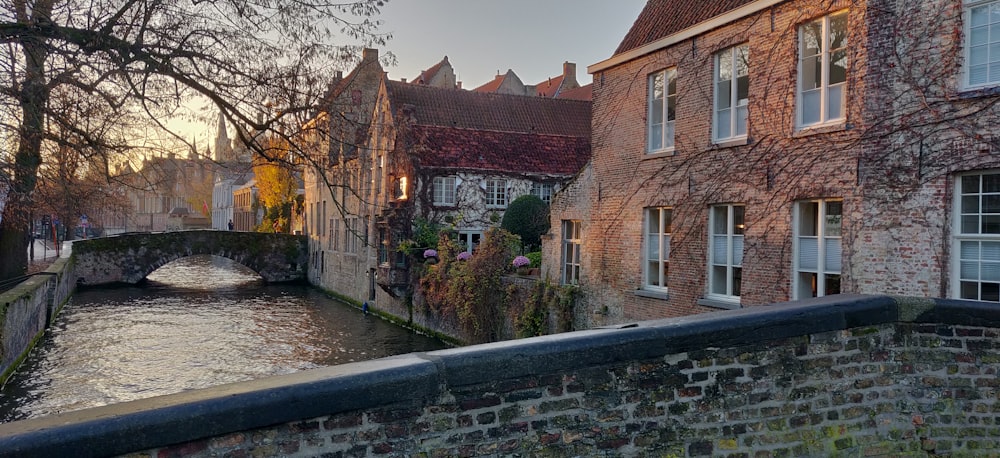 brown brick building near river