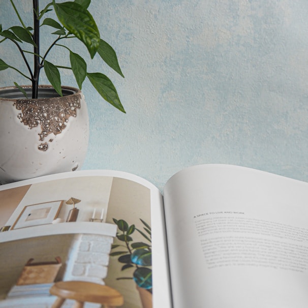 green plant on white book page