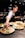 person in white shirt slicing vegetable