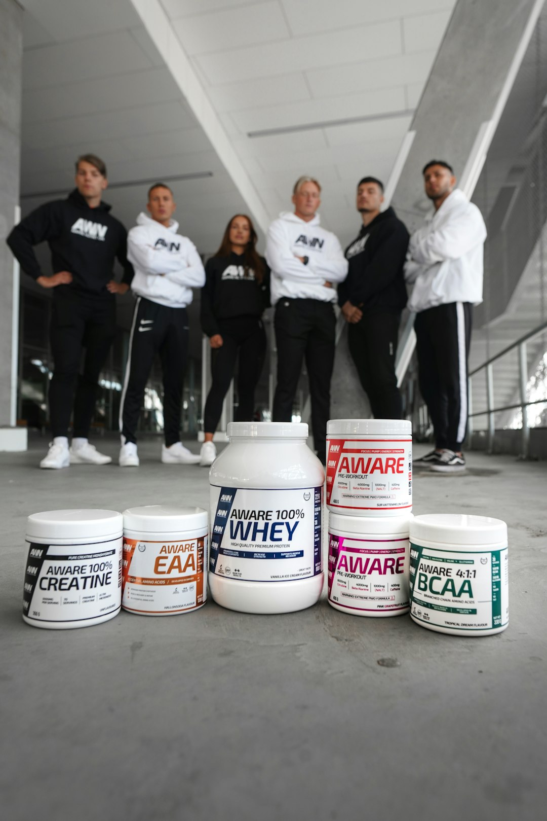 group of people standing on white floor tiles