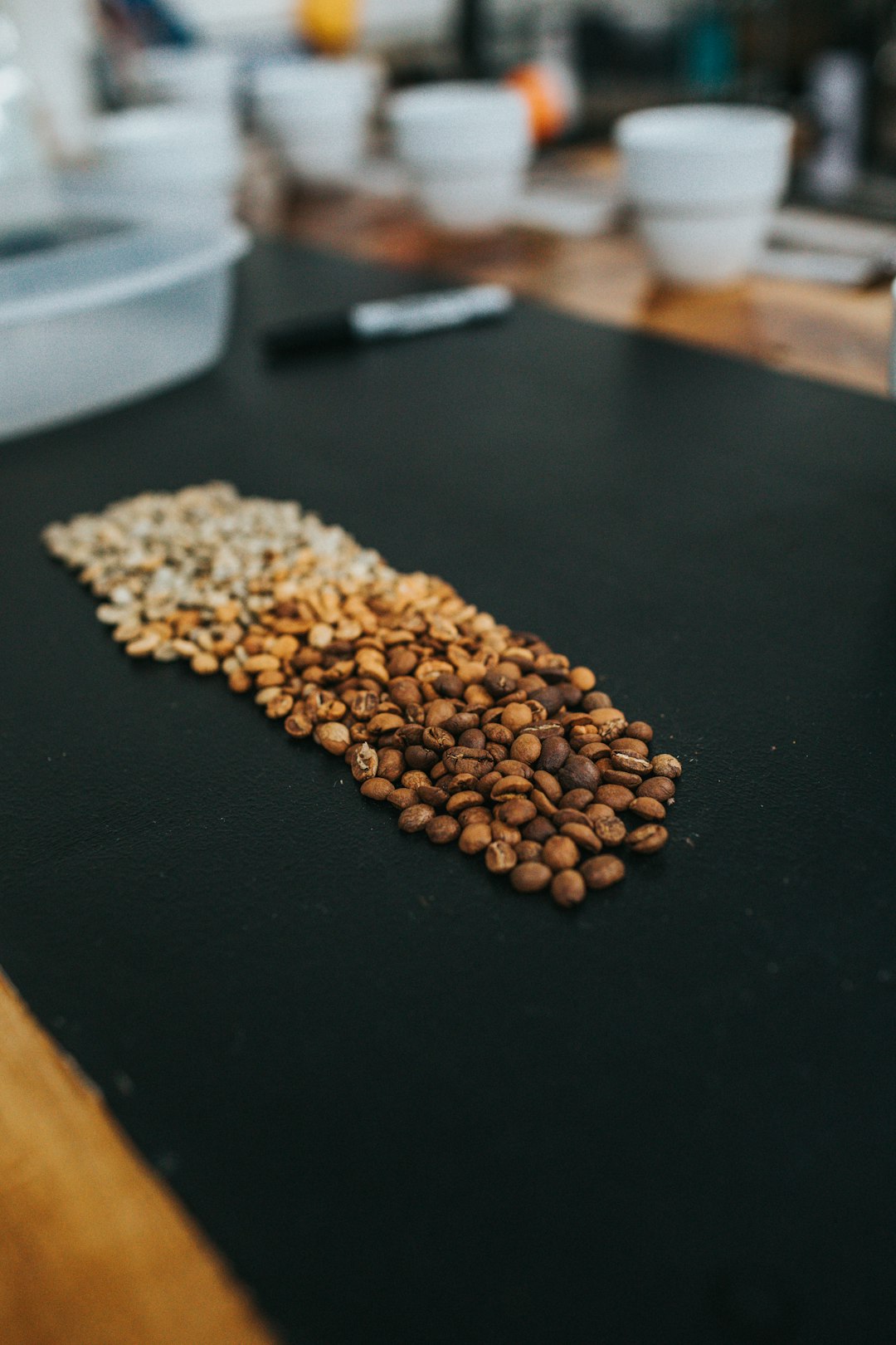 brown coffee beans on black table