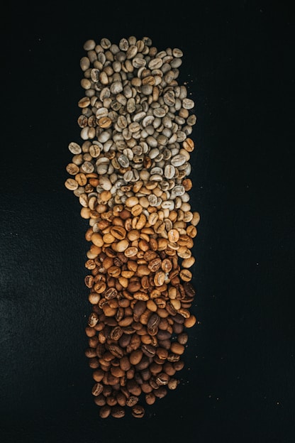 white and brown beads on black textile