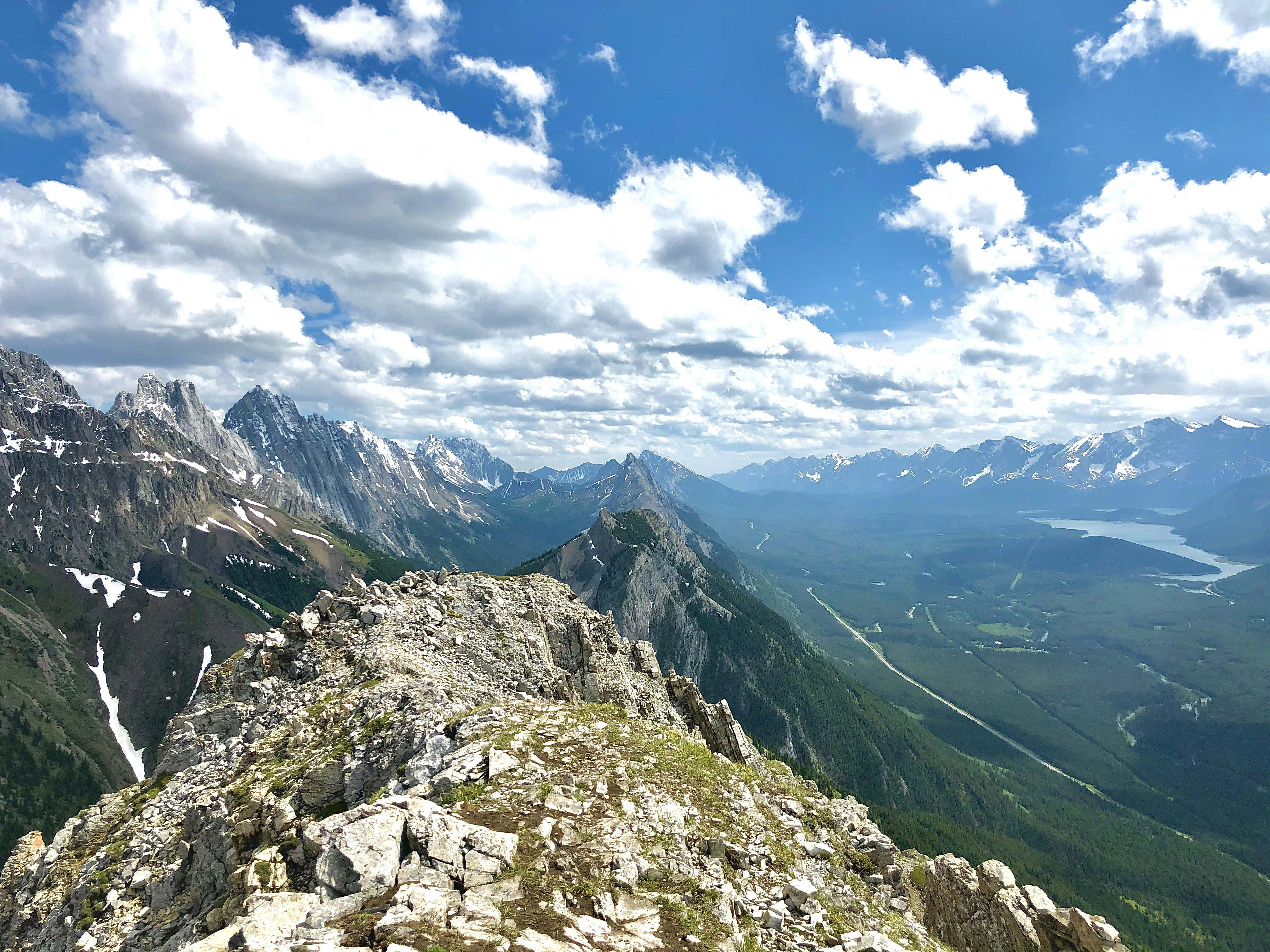 green and gray mountains under blue sky and white clouds during daytime