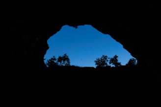 A serene view of the Cave of the Patriarchs during sunset with a clear sky.