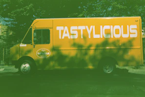 Our bright food truck parked on a sunny street, ready to serve authentic Deshi flavors