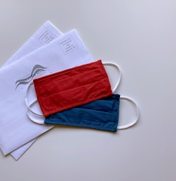 red and blue pouch on white paper