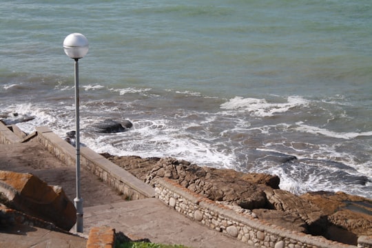 gray metal pole near sea during daytime in Mar del Plata Argentina