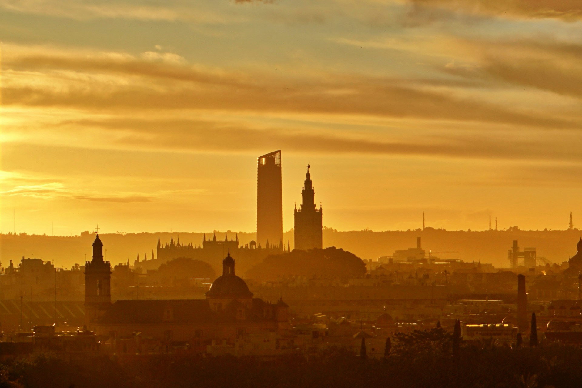 silhouette of city buildings during sunset