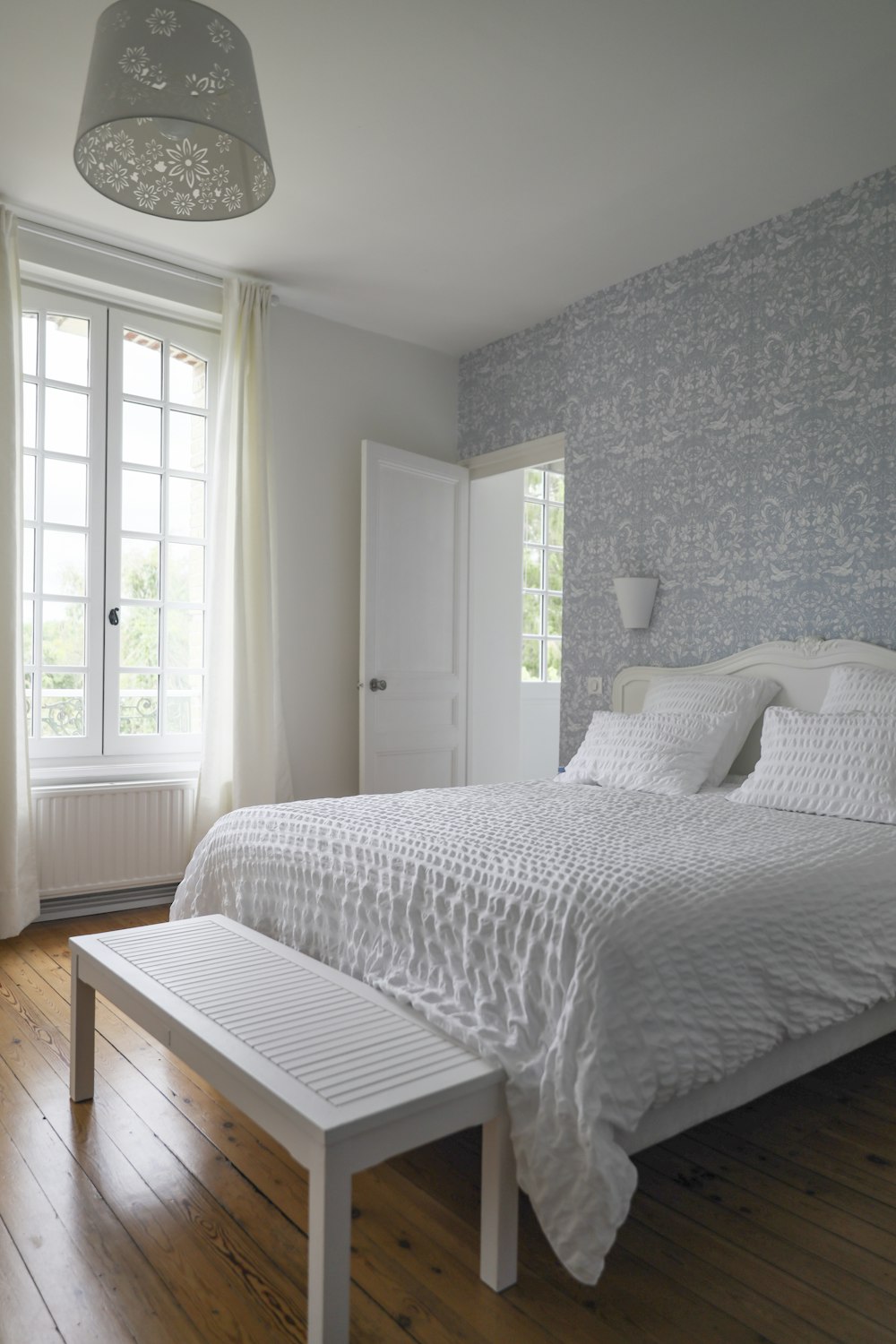 white and gray bed linen