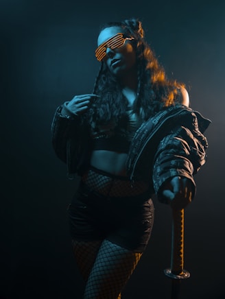 woman in black leather jacket and black and white plaid skirt