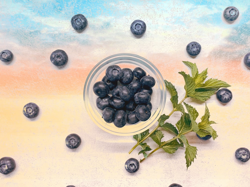 black berries on white ceramic plate