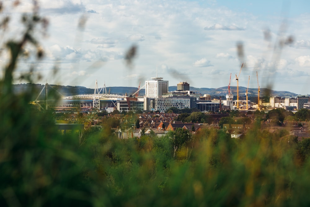 city skyline under white clouds during daytime