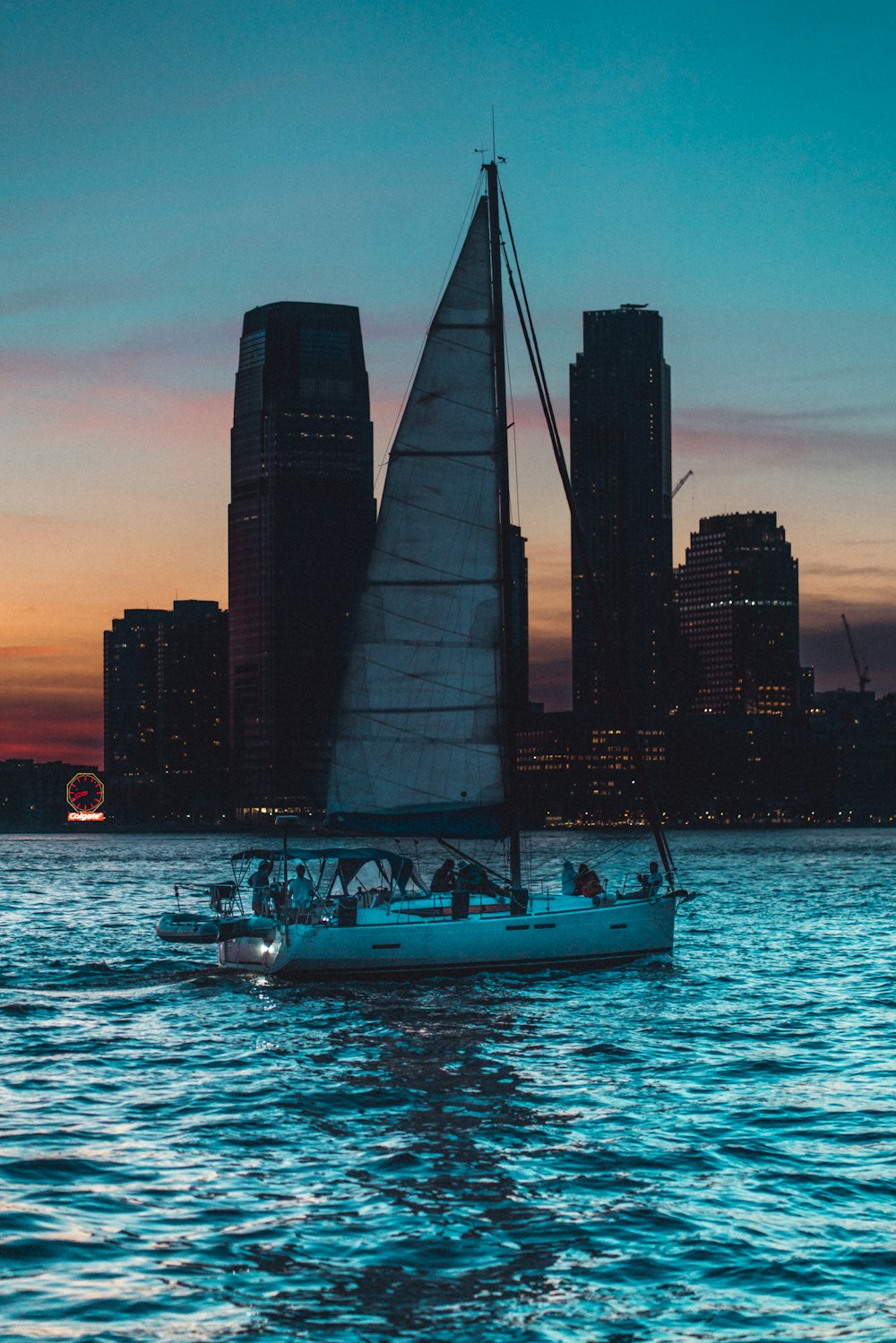 white and black sailboat on sea during daytime