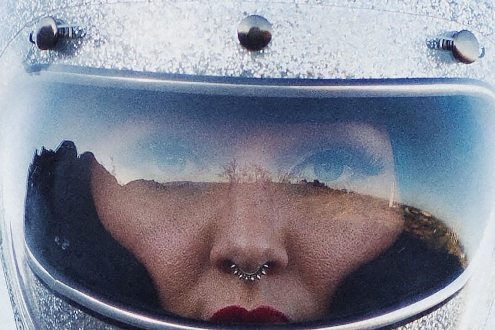 woman in red lipstick in blue plastic container