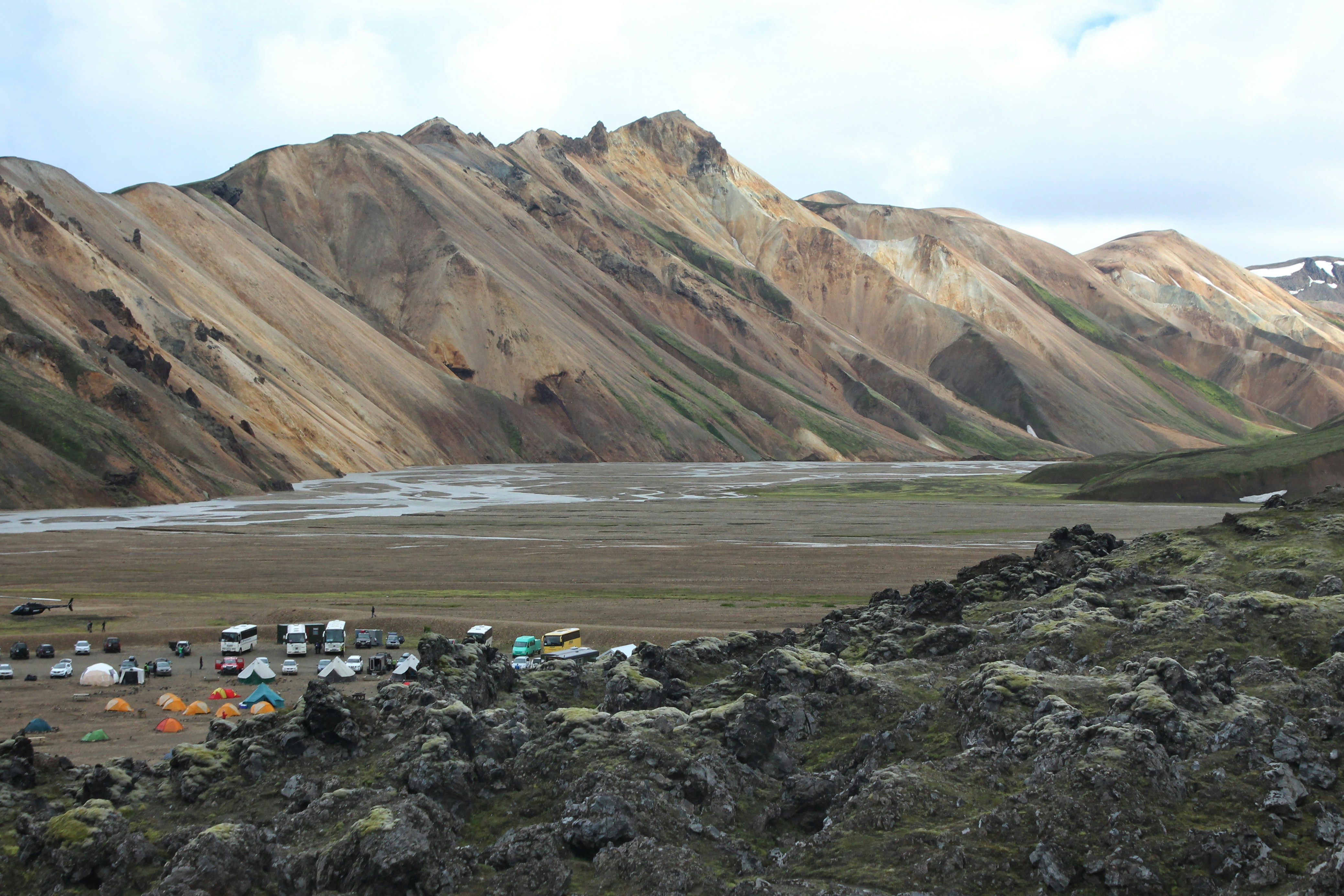 cars on road near mountain during daytime