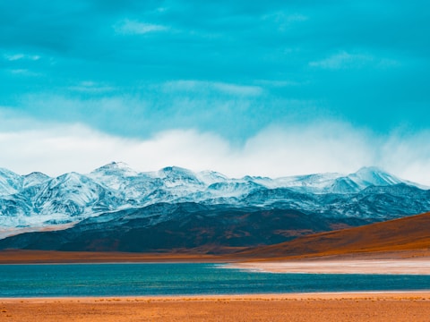 snow covered mountain under blue sky during daytime