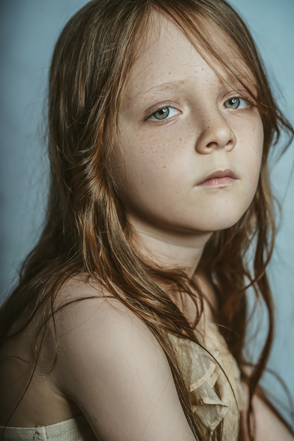 woman with brown hair looking up