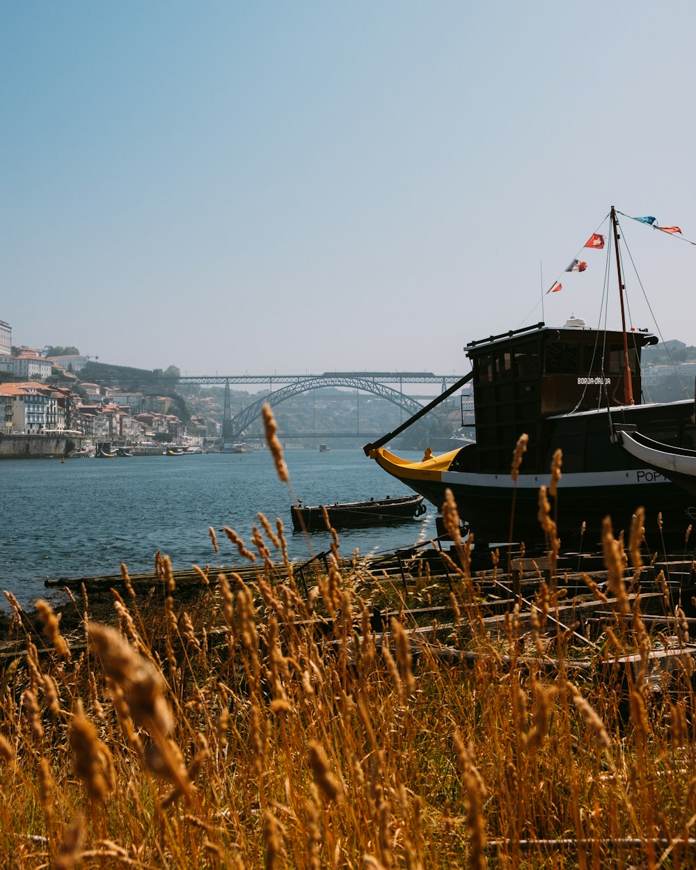 brown boat on sea during daytime