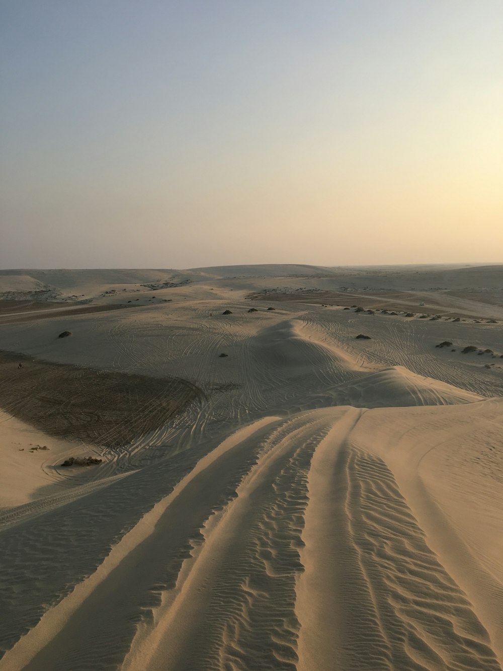 white sand under blue sky during daytime