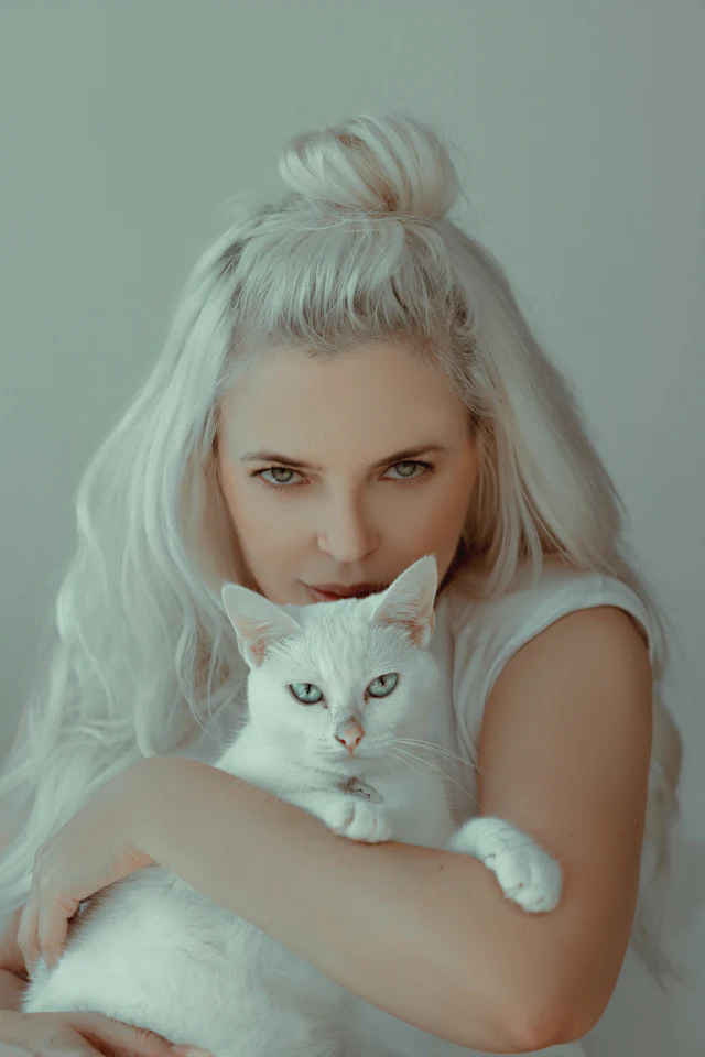 Woman with her cat on her lap