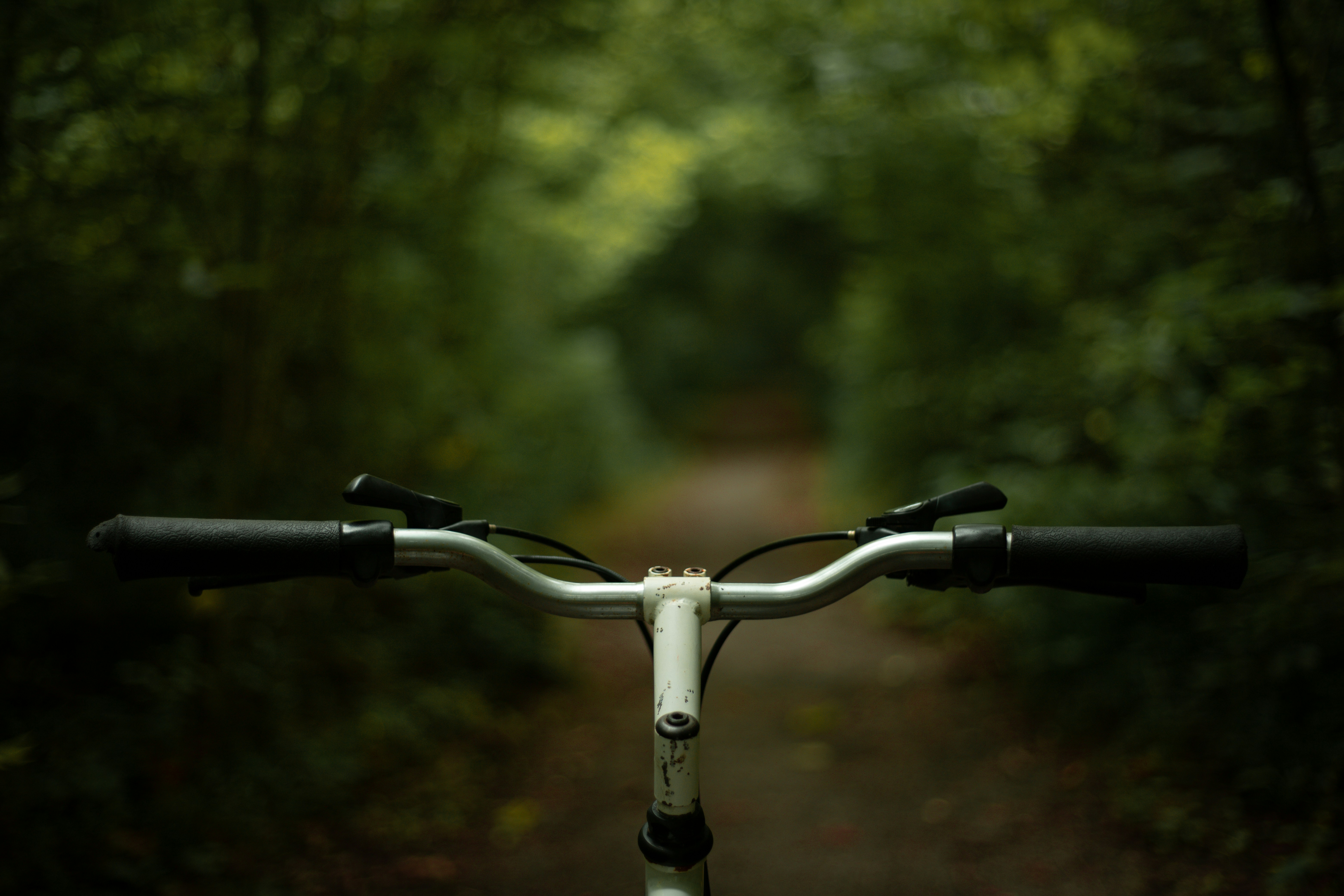 black and white bicycle on road during daytime